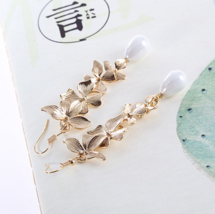 Wholesale Sweet flower pearl earrings long tassel gold orchid matte hook