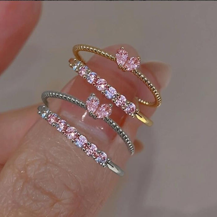 Wholesale Set of open-faced diamond-encrusted heart-shaped rings.