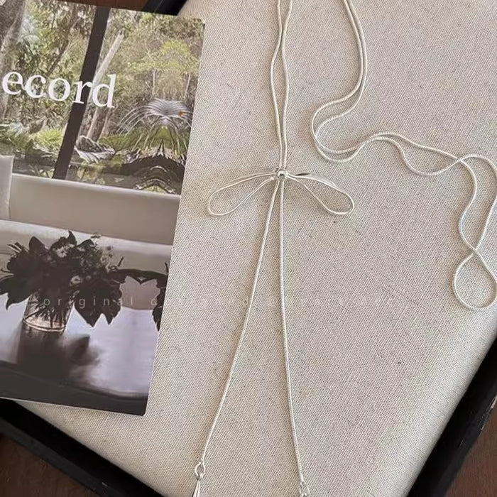 Wholesale Silver bow necklace for women, simple and cool style, long accessory with temperament, collarbone chain