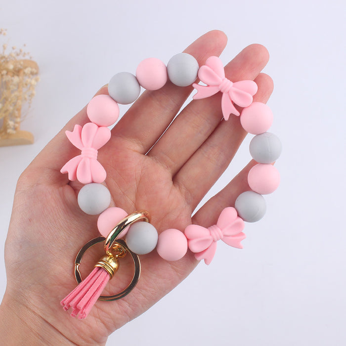 Wholesale PU Cartoon Bowknot Silicone Handmade Beaded Wrist Keychain JDC-KC-GuangTian006