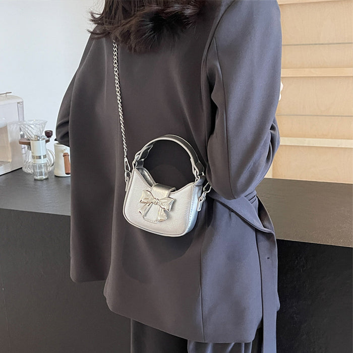 Wholesale New retro oil leather handbag with shiny bow and chain crossbody bag