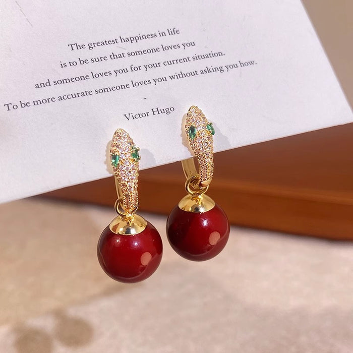 Wholesale Full diamond earrings with a niche design, snake shaped pearl earrings, unique earrings, and ear buckles