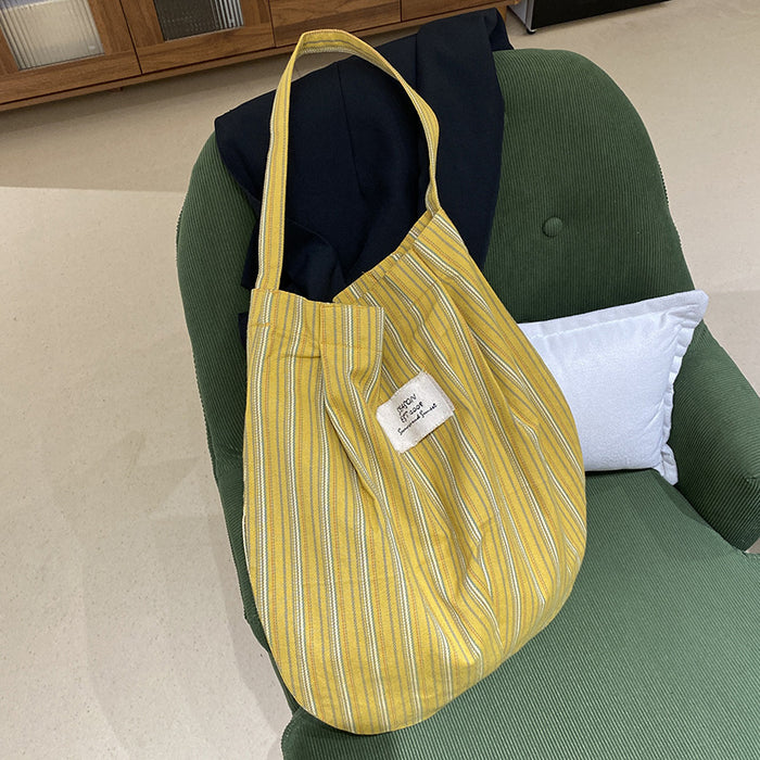 Wholesale Splicing striped canvas bag with simple temperament and large capacity commuting shoulder bag