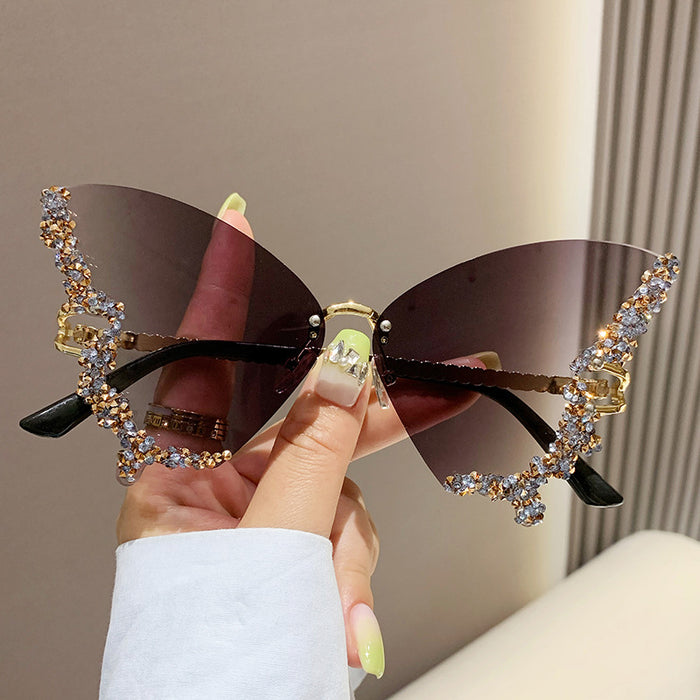 Wholesale New butterfly studded diamond rimless sunglasses with fashionable and exaggerated personality
