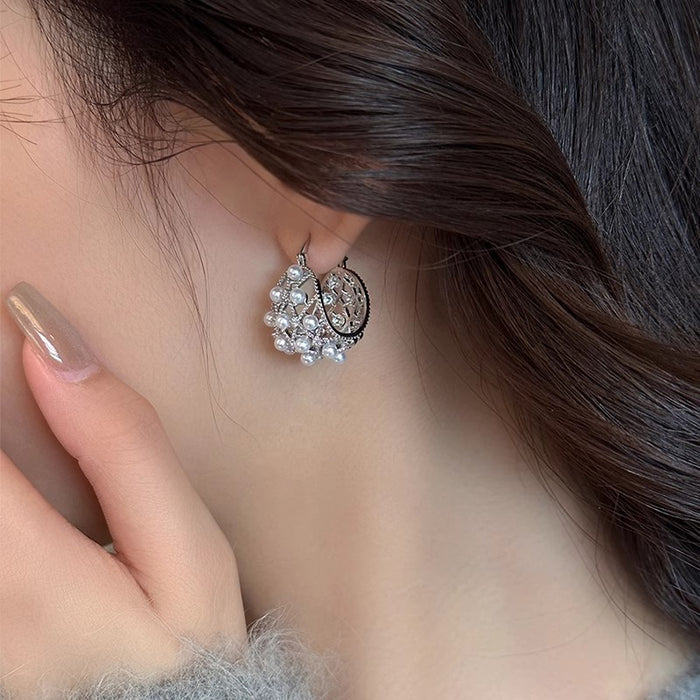 Wholesale Elegant hollow pearl earrings with high-end ear loops, niche design, high-end and unique earrings