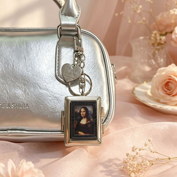 Wholesale Double-Sided Cosmetic Mirror Mona Pattern Bag Charm Keychain Zinc Alloy Boutique