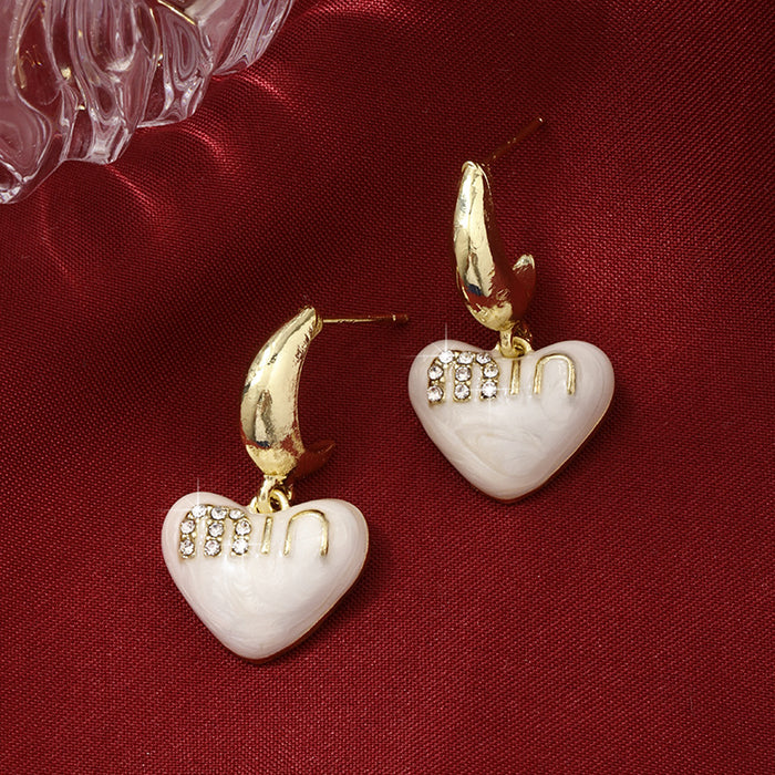 Wholesale Love earrings, niche design, light luxury, high-end, silver needle earrings, temperament