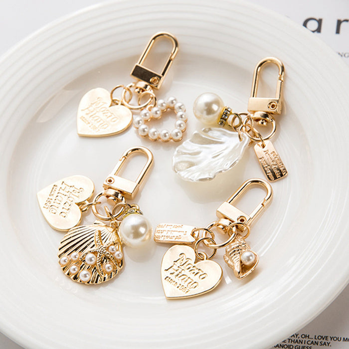 Wholesale Wholesale of metal keychains, cute shell key pendants, wholesale of bags and pendants, creative small gifts for gifting