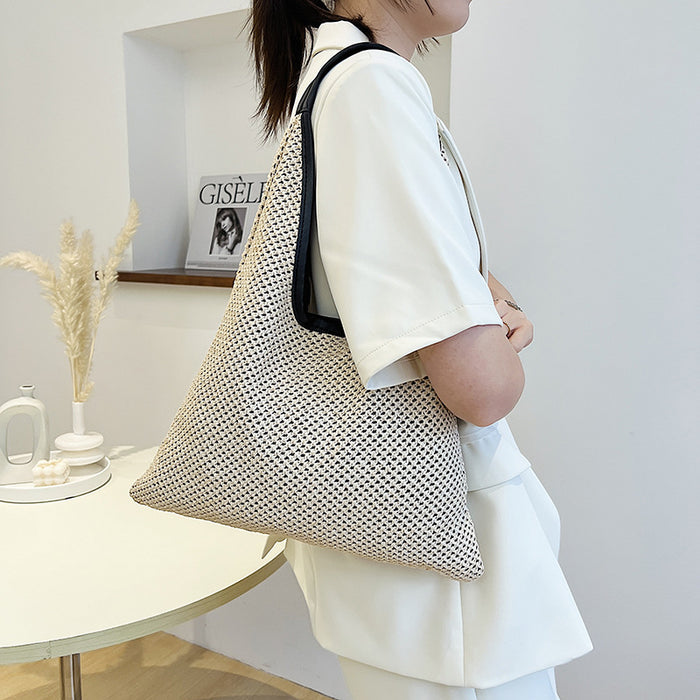 Wholesale New straw woven bag, fashionable and simple hollow shoulder bag, vacation and western-style beach bag, grass woven