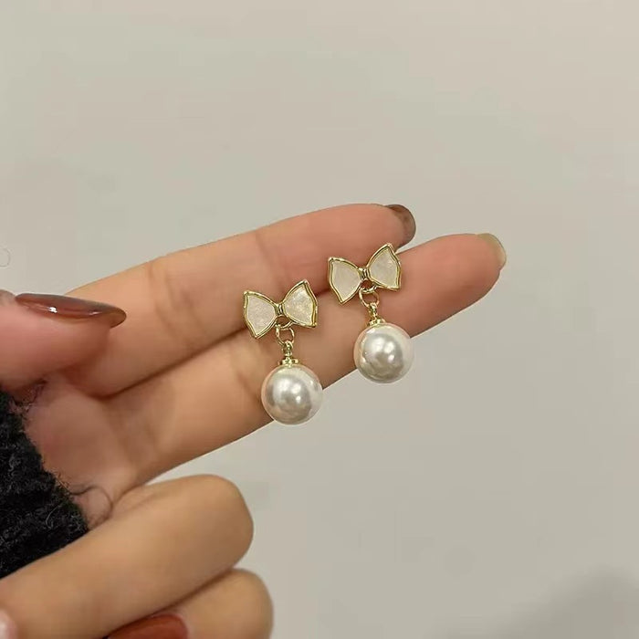 Wholesale New pearl bow pearl earrings, fashionable oil dripping accessories, high-end and versatile trendy earrings