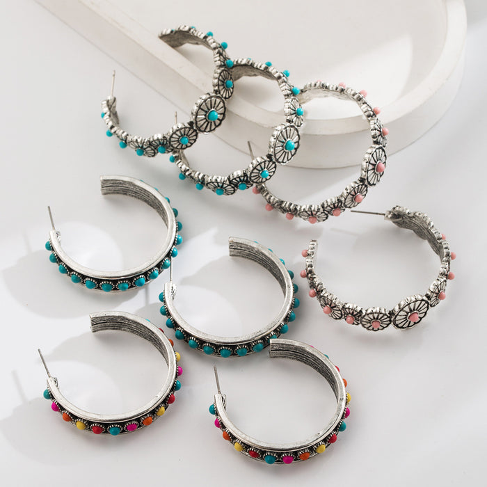 Wholesale Large C-shaped alloy statement earrings set with white and turquoise