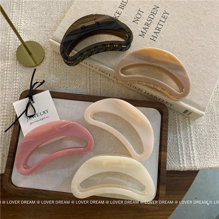 Wholesale Pink semi-circular hair clip with shark clip at the back of the head, versatile hair accessory