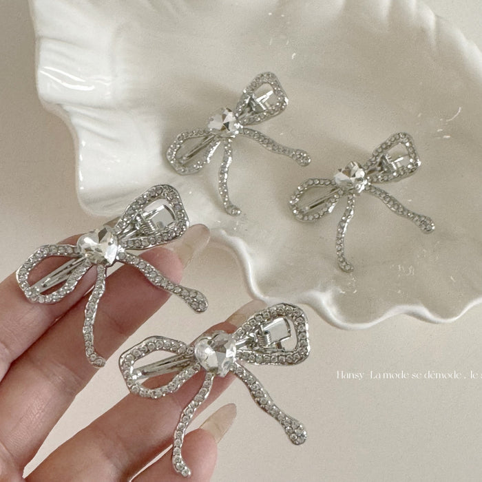 Wholesale Silver heart-shaped diamond bow hair clip, alloy duckbill clip, niche design, bangs clip, edge clip, hair accessory