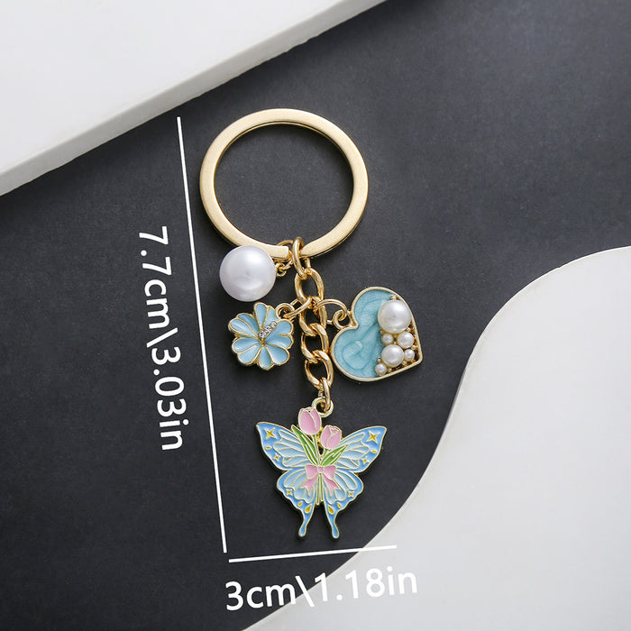Wholesale Oil-dripping purple heart-shaped pearl tulip flower butterfly metal keychain
