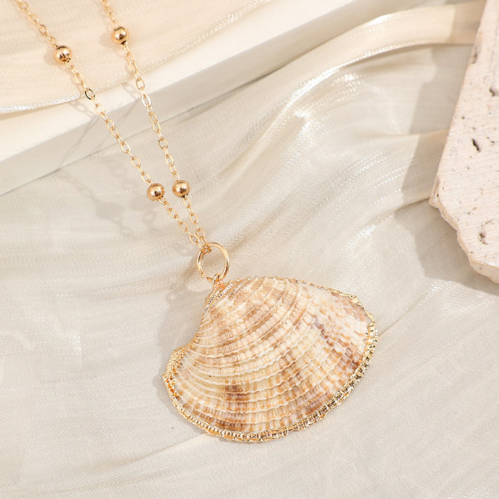 Wholesale Gold edged conch and seashell necklace