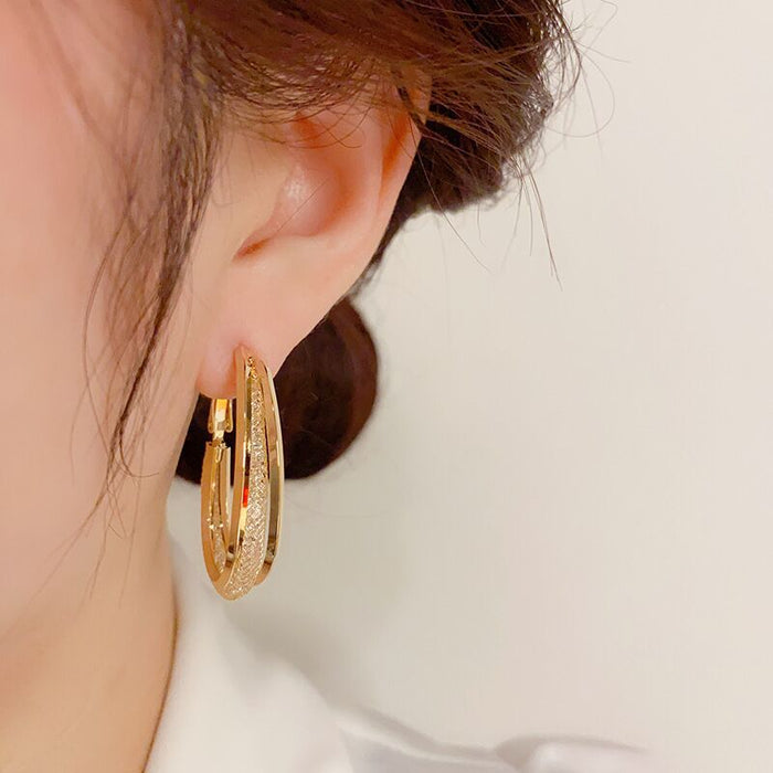 Wholesale Metal earrings with hollowed out mesh and crystal circles, earrings with a subtle touch of elegance, and female earrings with inlaid details