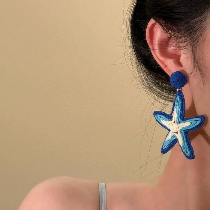 Wholesale Spring and summer new holiday style hand woven starfish earrings Bohemian  earrings