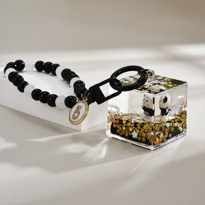 Wholesale Black and gold glitter bottle milk tea cup oil-filled acrylic keychain