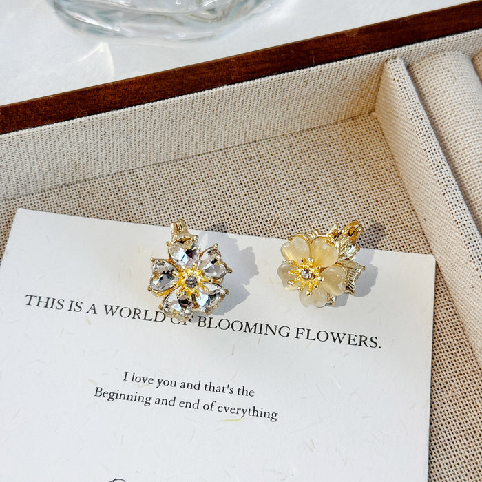 Wholesale Fashionable temperament, high-end earrings, light luxury, super fairy earrings, cat eye stones, double-sided flower ear buckles