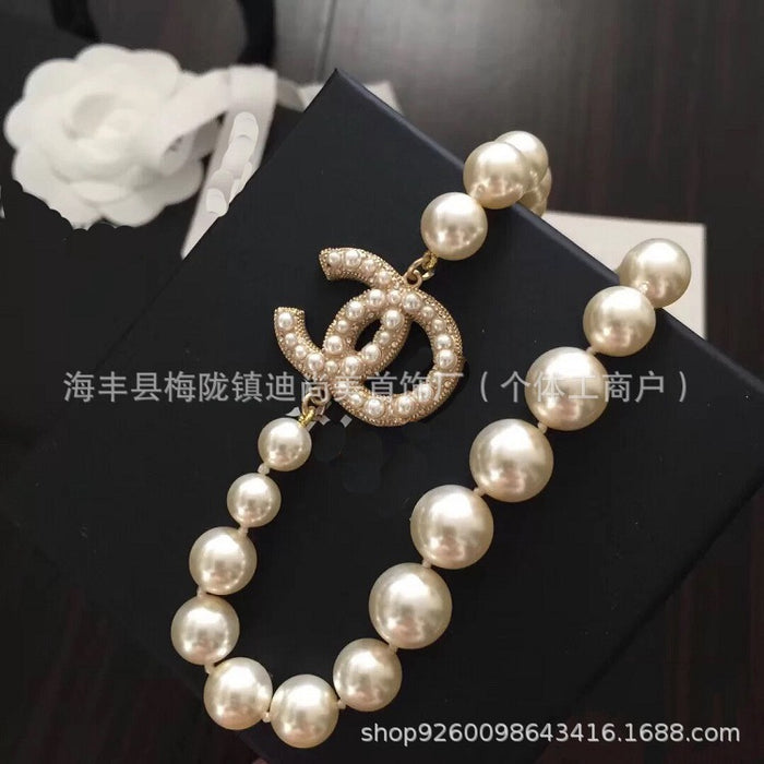 Wholesale Double C letter enamel camellia pearl long necklace