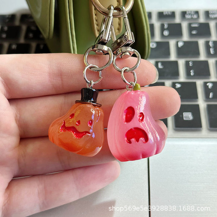 Wholesale Novelty  Pumpkin Pendant Keychain Glow In The Dark Resin Black Hat Design Bag And Earphone Case Charm Gift For Students And Couples