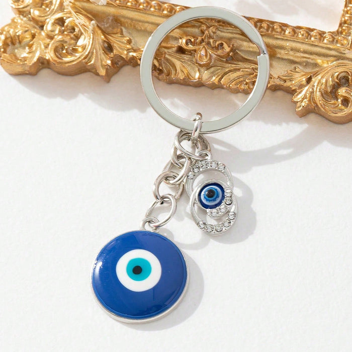 Wholesale Diamond-encrusted blue eyes evil eye tassel keychain
