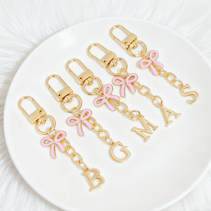 Wholesale Pink bow A-Z keychain alloy accessory