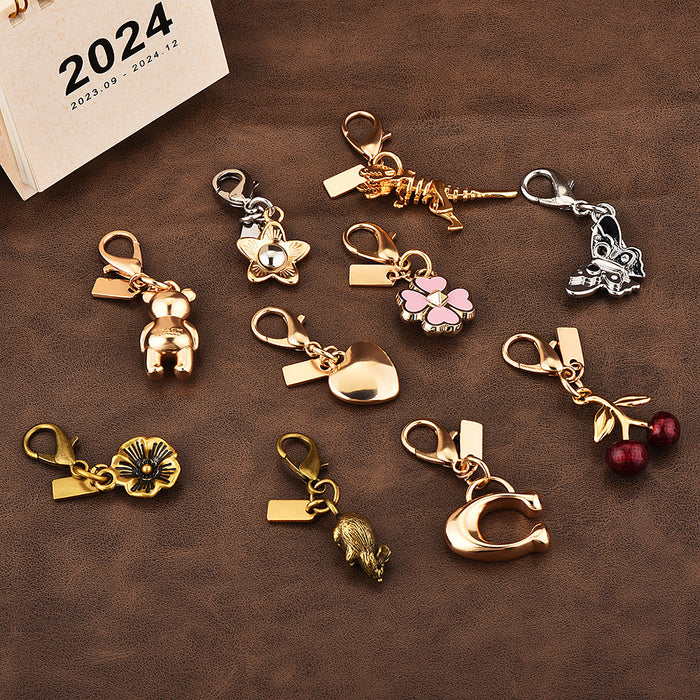Wholesale Car key pendant high sense bag accessories gold color bear cherry four-leaf clover butterfly schoolbag jewelry