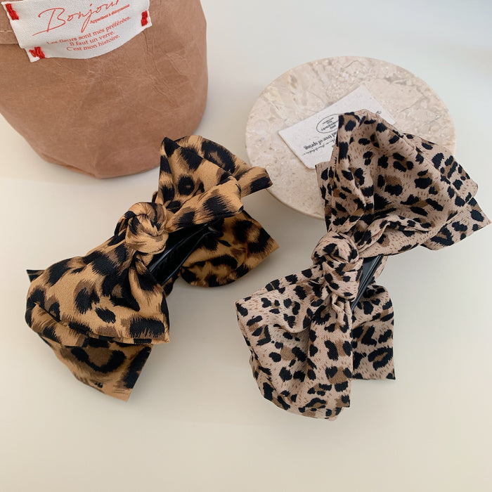 Wholesale Leopard print bow ball head clip female retro high ponytail fixed hairpin back of the head hair shark clip