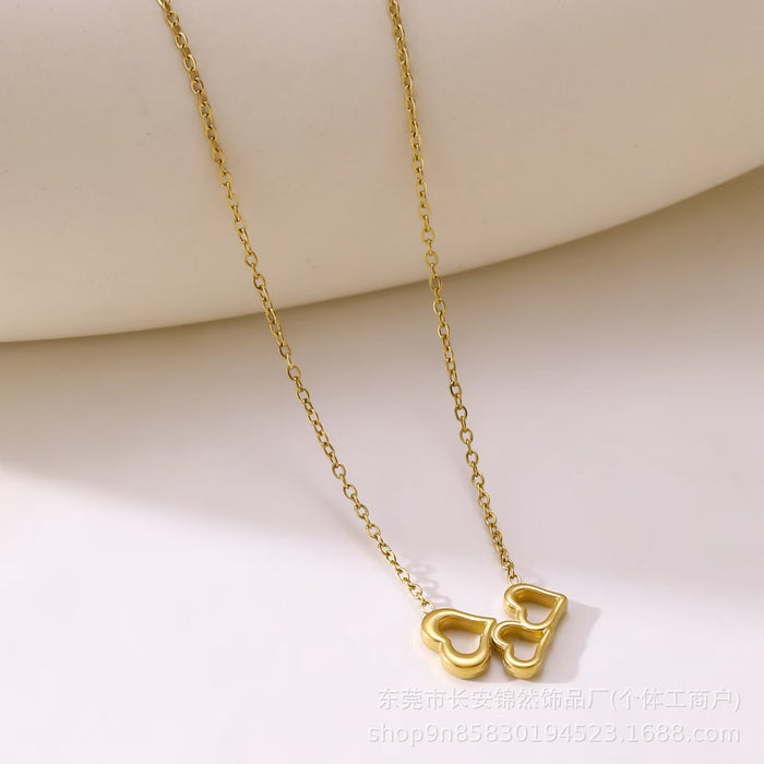 Wholesale Hollow out three-heart stainless steel necklace and bracelet set