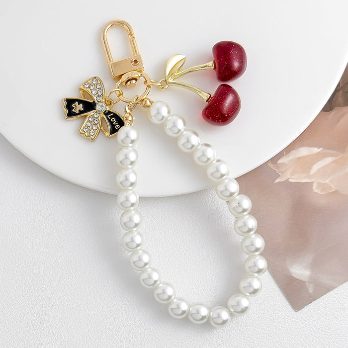 Wholesale Pearl chain beaded mobile phone lanyard bow pendant keychain