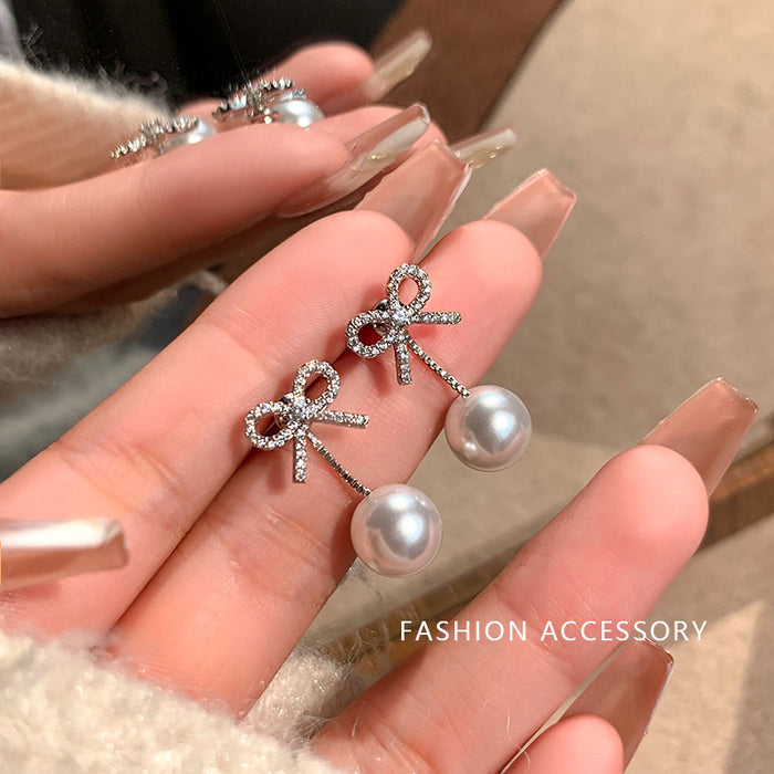 Wholesale Butterfly knot imitation pearl tassel earrings, light luxury temperament, earrings, earrings, studs, earrings