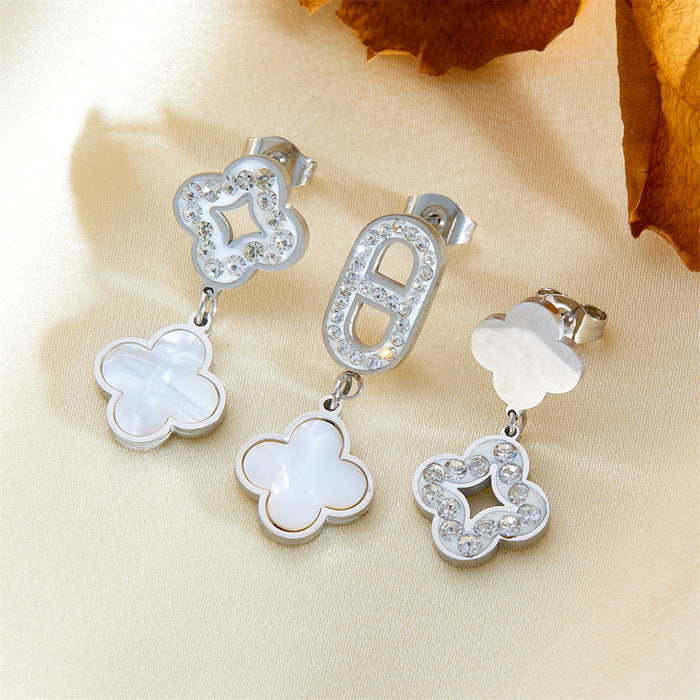 Wholesale Three four-leaf clover-shaped earrings with diamond embellishments.