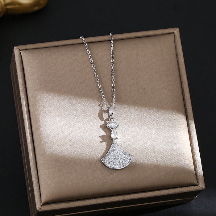 Wholesale Titanium steel necklace with a small dress pendant encrusted with rhinestones.