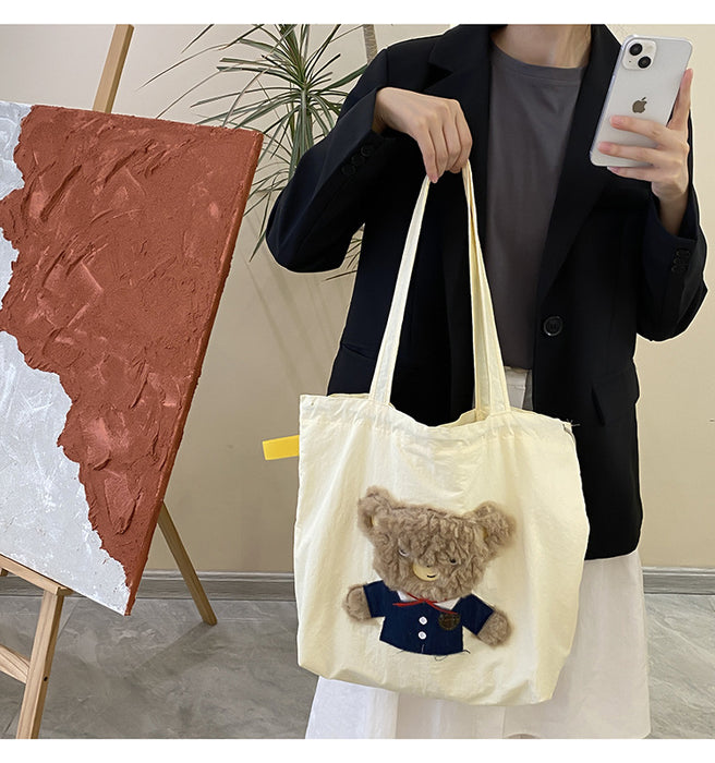 Wholesale New cute cartoon embroidered drawstring shoulder bag, fashionable and simple canvas bag, large capacity tote bag
