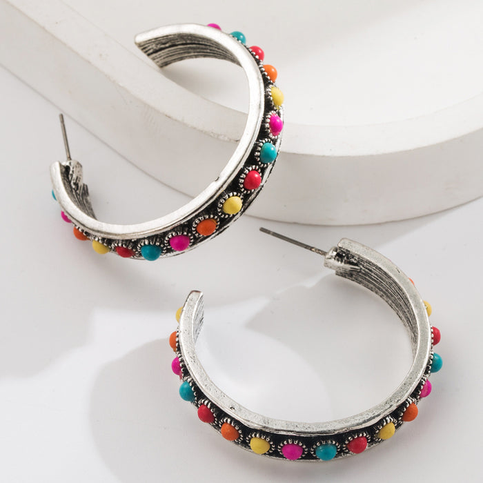 Wholesale Large C-shaped alloy statement earrings set with white and turquoise