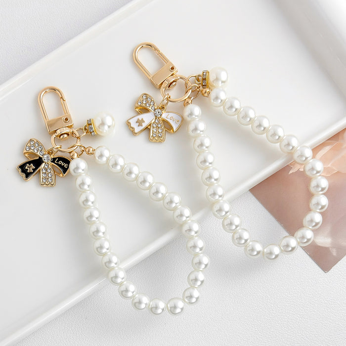 Wholesale Pearl chain beaded mobile phone lanyard bow pendant keychain