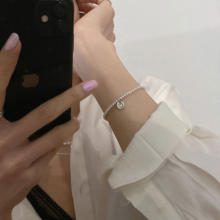 Wholesale Pure silver heart-shaped round bead bracelet with a new niche design, high-end feel, and light luxury bracelet accessories