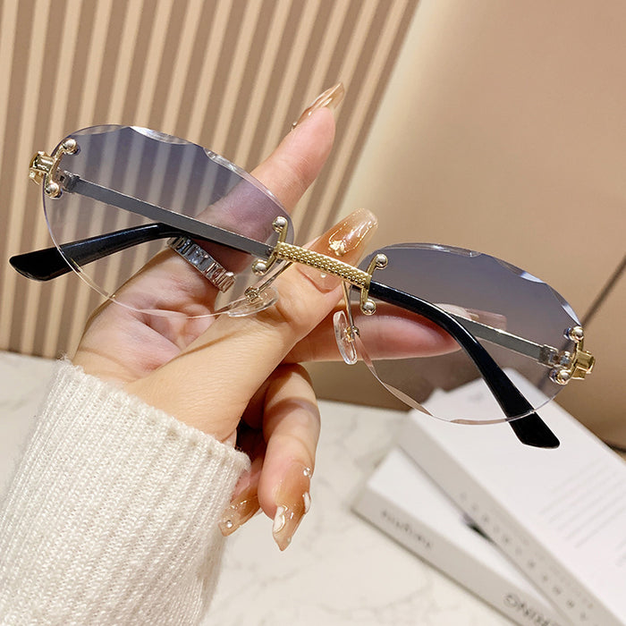 Wholesale Frameless cut sunglasses, fashionable oval frame glasses, gradient sunglasses