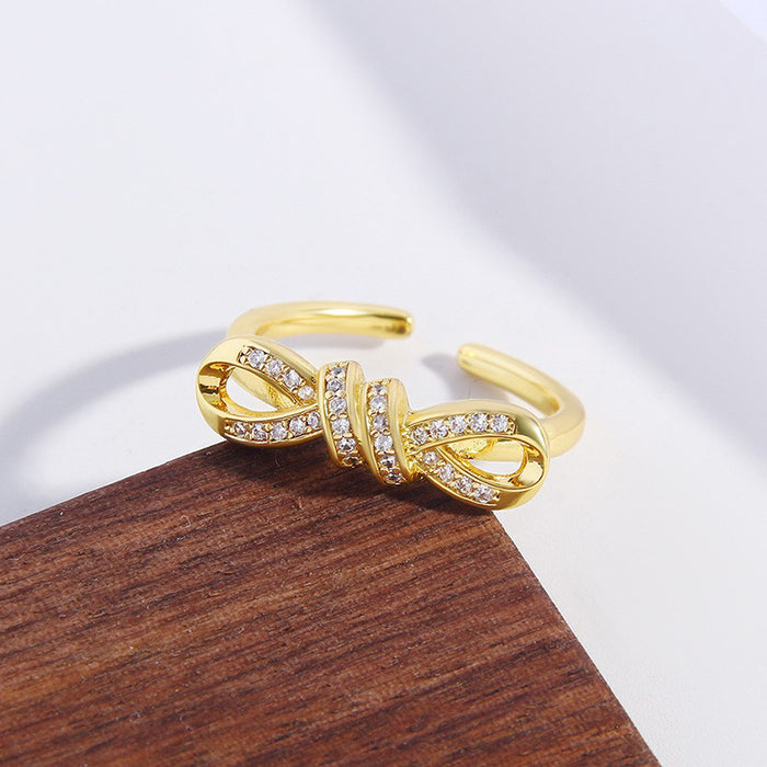 Wholesale Copper Gold Plated Irregular Zircon Twisted Rope Bow Ring JDC-RS-BaiTian004