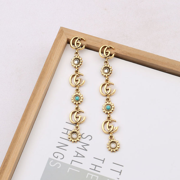 Wholesale double G Letter Elegant Versatile Tassel Earrings Daisy Accessible