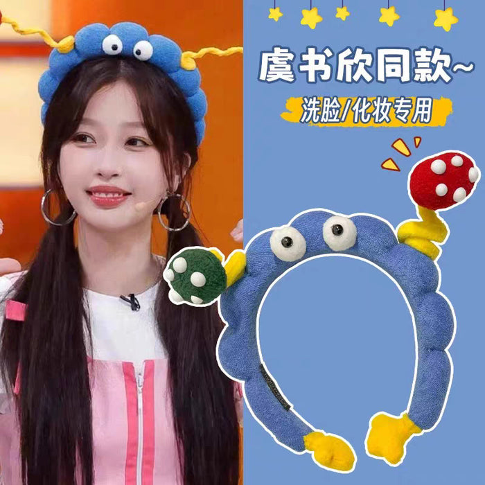 Wholesale Cute girl' s twistable hairband with big-eyed plush toy design.