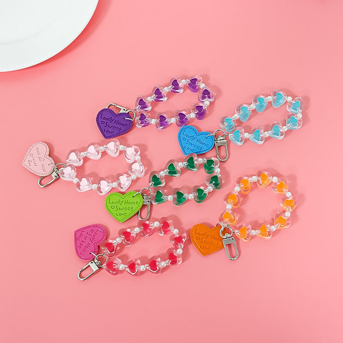 Wholesale fresh simple color love hand chain transparent acrylic chain mobile case accessories