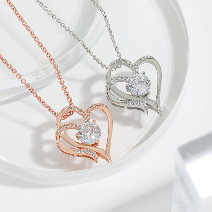 Wholesale Cross border platinum double heart pendant necklace with elegant temperament and high-end feel, set with zircon heart necklace