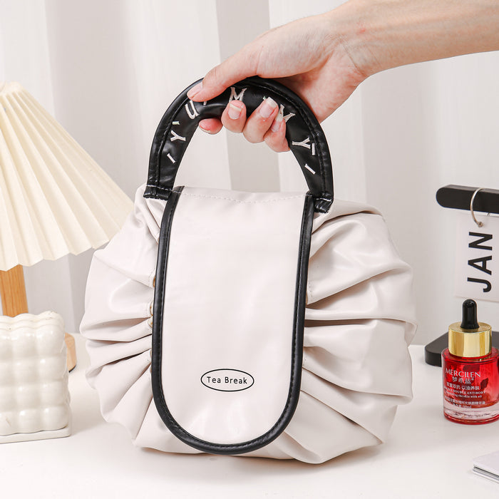 Wholesale PU Pink Cylindrical Cosmetic Bag Light Luxury Drawstring Travel Makeup Pouch For Women