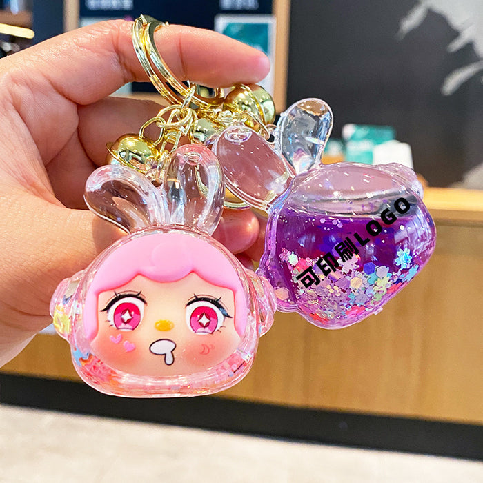 Wholesale Oil-flow sand earphone rabbit keychain