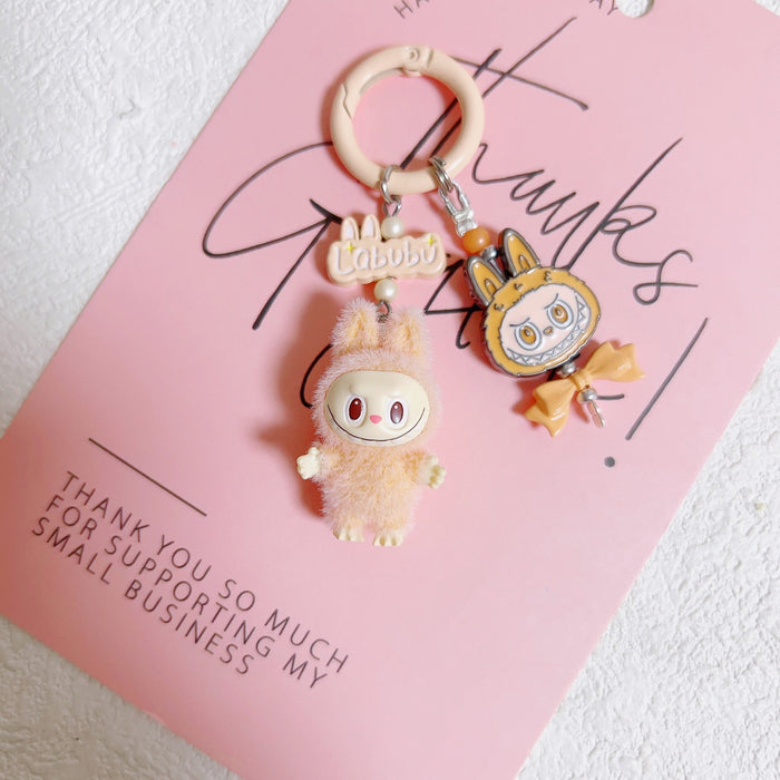 Wholesale Doll Enamel Sitting Posture Cute Mobile Phone Pendant Keychain