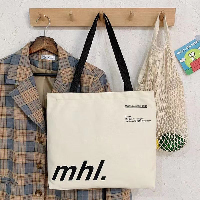 Wholesale New canvas bag, niche letter printed shoulder bag, large capacity commuting tote bag