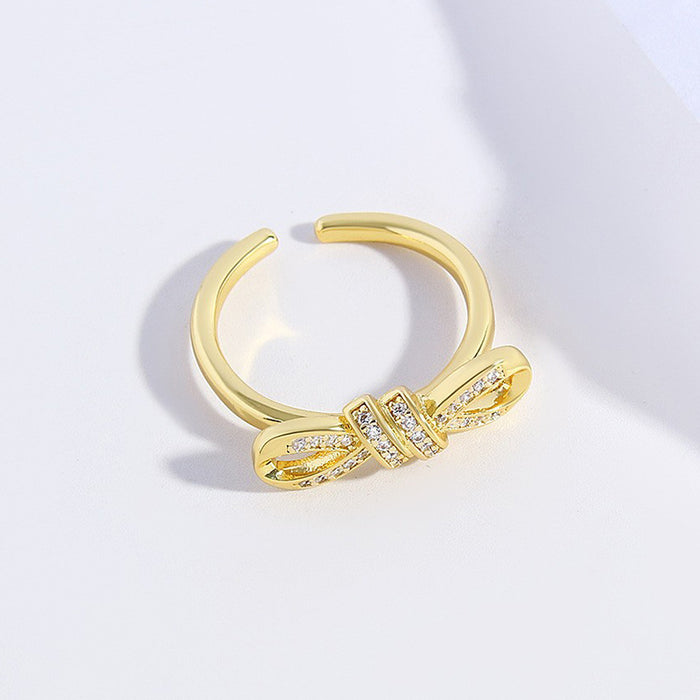 Wholesale Copper Gold Plated Irregular Zircon Twisted Rope Bow Ring JDC-RS-BaiTian004