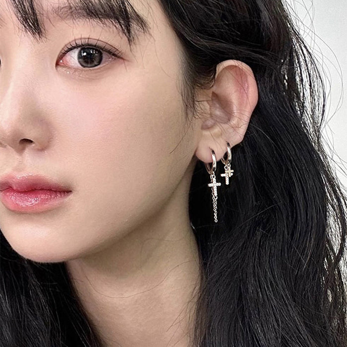 Wholesale Double layered cross studded diamond earrings with neutral tassels and asymmetrical cross shaped ear loops